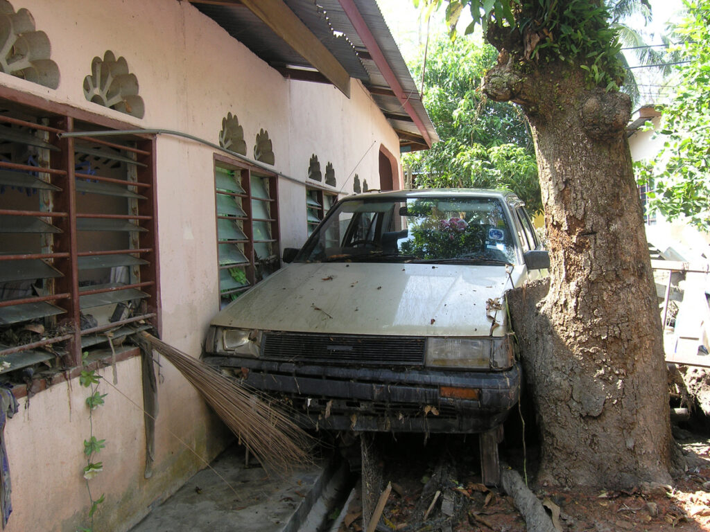 A motorist plowed through the front of a house in Moreno Valley today, injuring himself and the resident.