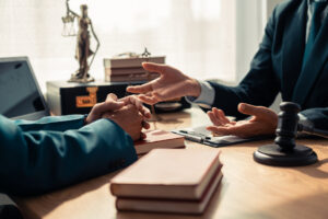 A lawyer speaking with a client regarding an accident.
