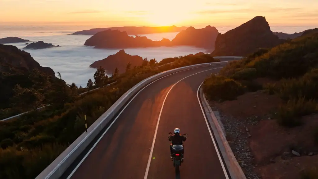 A man riding a motorcycle, which leads to the question: how dangerous are motorcycles in California?