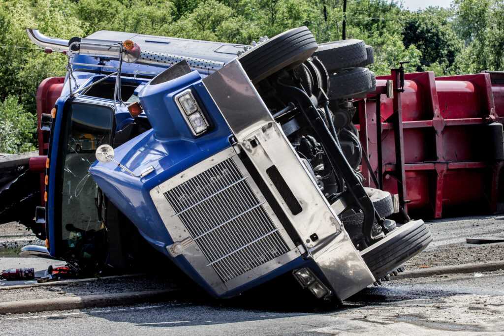A semi-truck crashed and struck two other vehicles, leaving a driver with minor injuries in an Interstate 15 Freeway accident in Riverside.