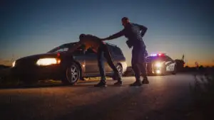 A man being arrested after committing a misdemeanor.