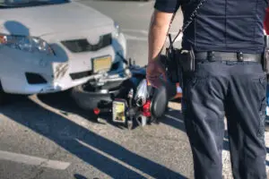 A motorcyclist was killed after their vehicle collided with a black sedan in a 10th Street West collision in Lancaster.
